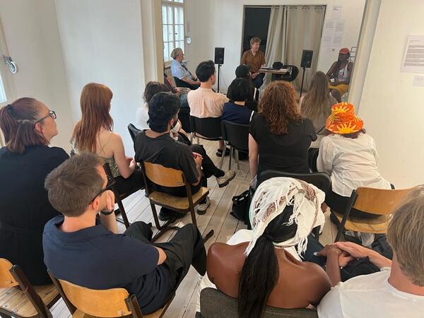 A group of listeners with Elsa M'bala